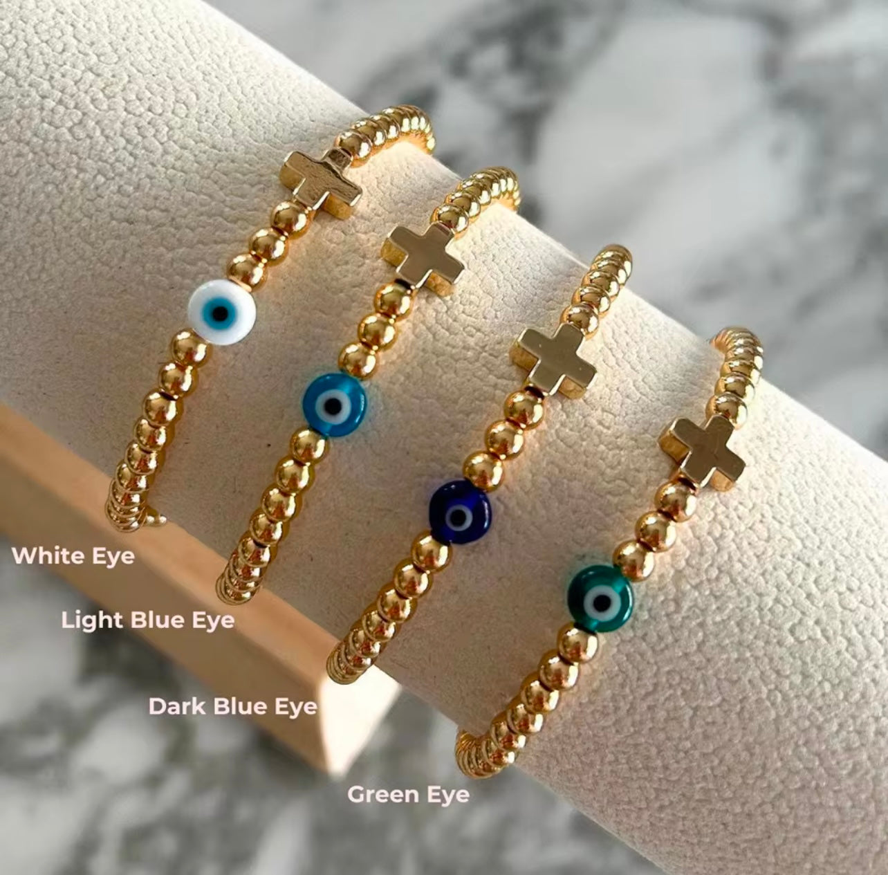 White eye or blue and cross gold plated beaded bracelet